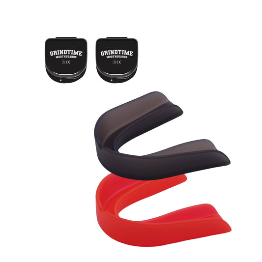 Two GT Performance Mouthguards, black and red, with two black cases in the left upper corner